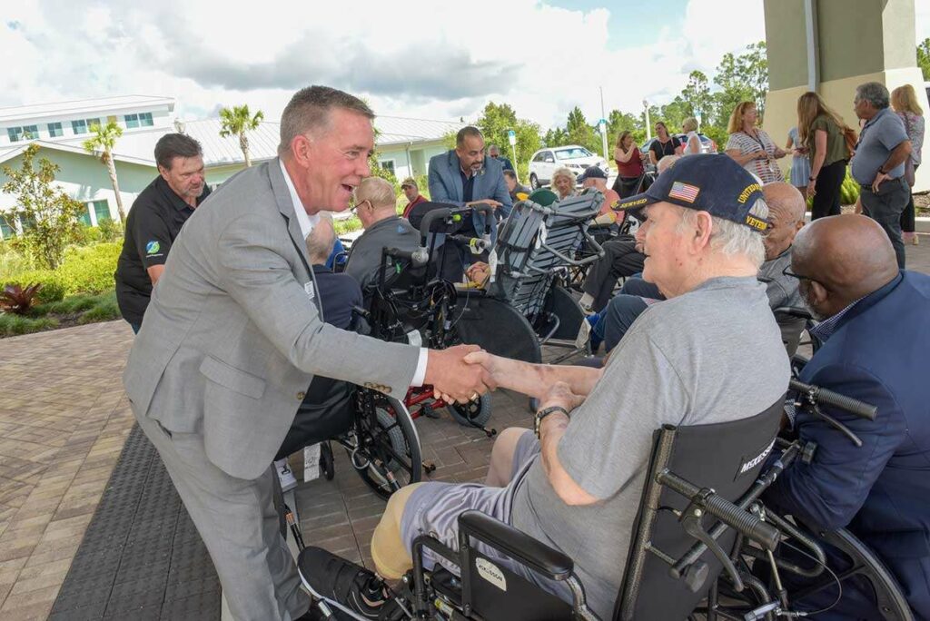 Veterans Bench Dedication - Sean shaking hands with Vet